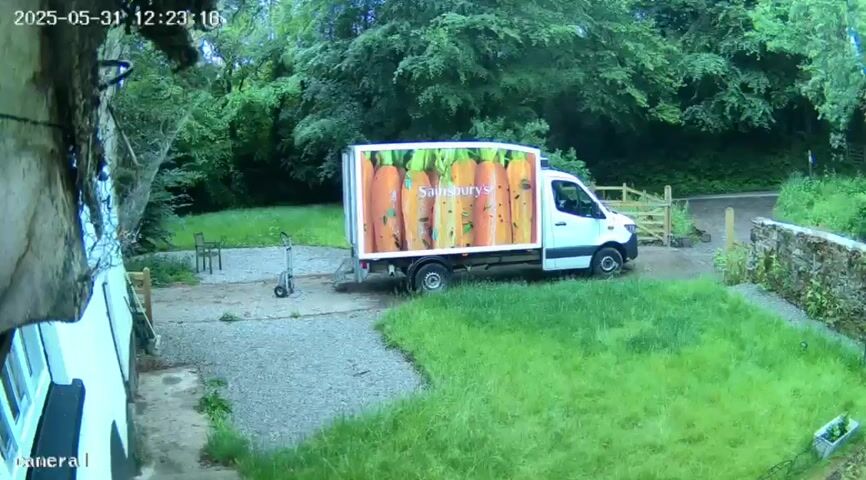 Camera still from The delivery driver recalls earlier boundary disputes